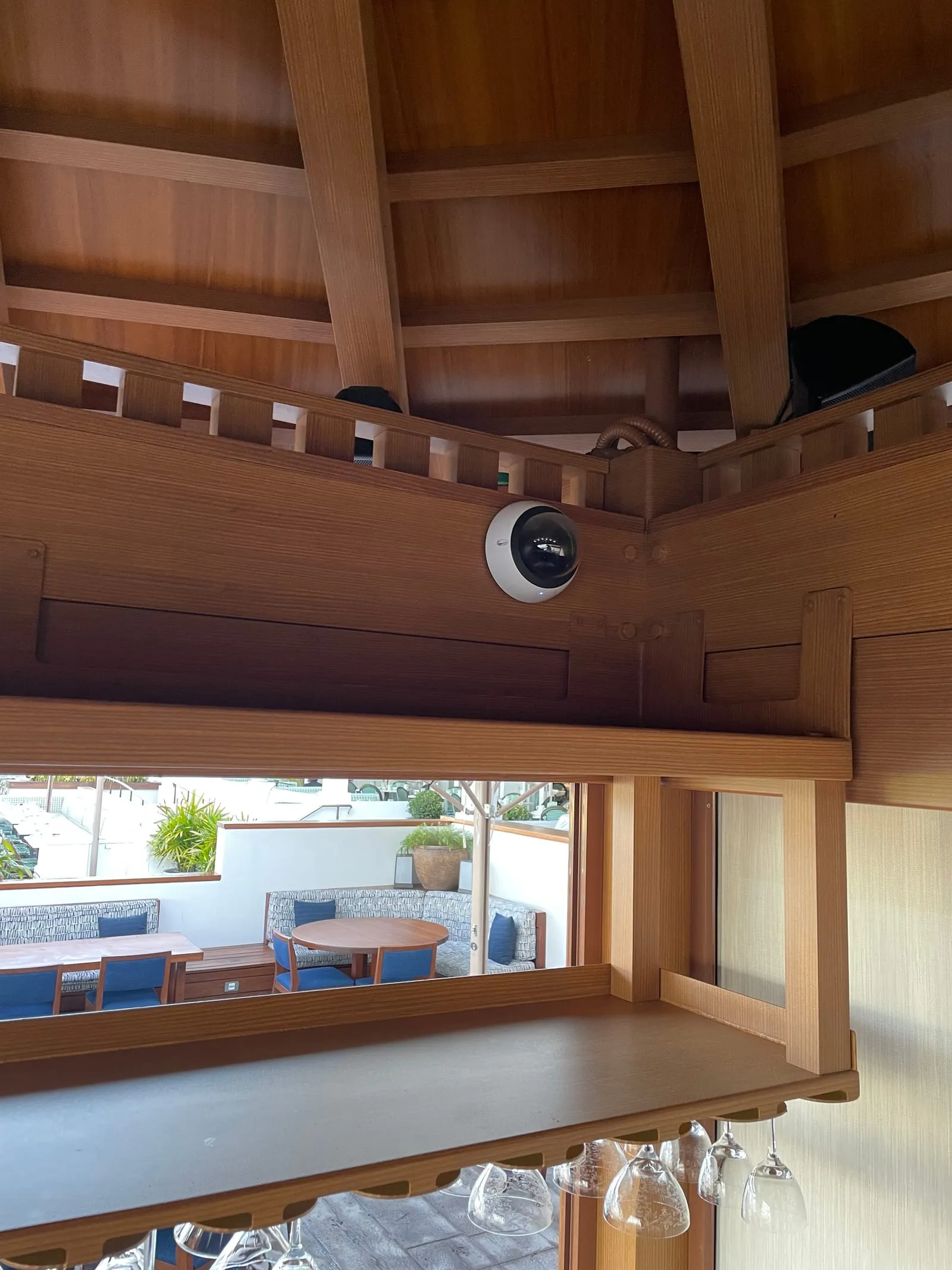 Verkada dome camera covering the bar pavilion with views to the pool patio