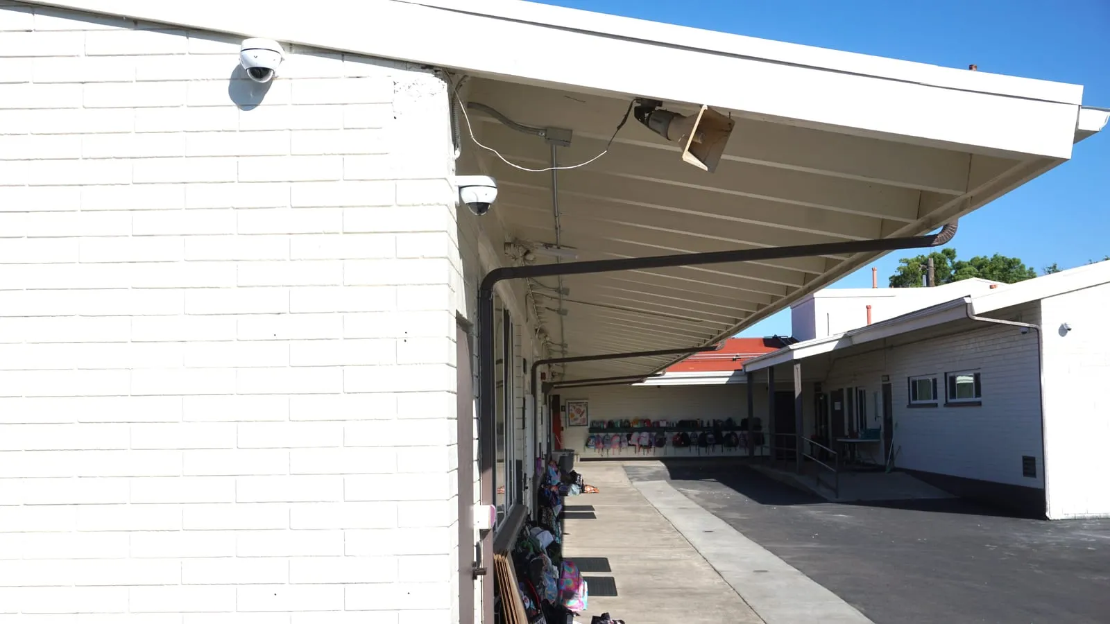 Dual Verkada dome cameras covering St. Columba campus corridors
