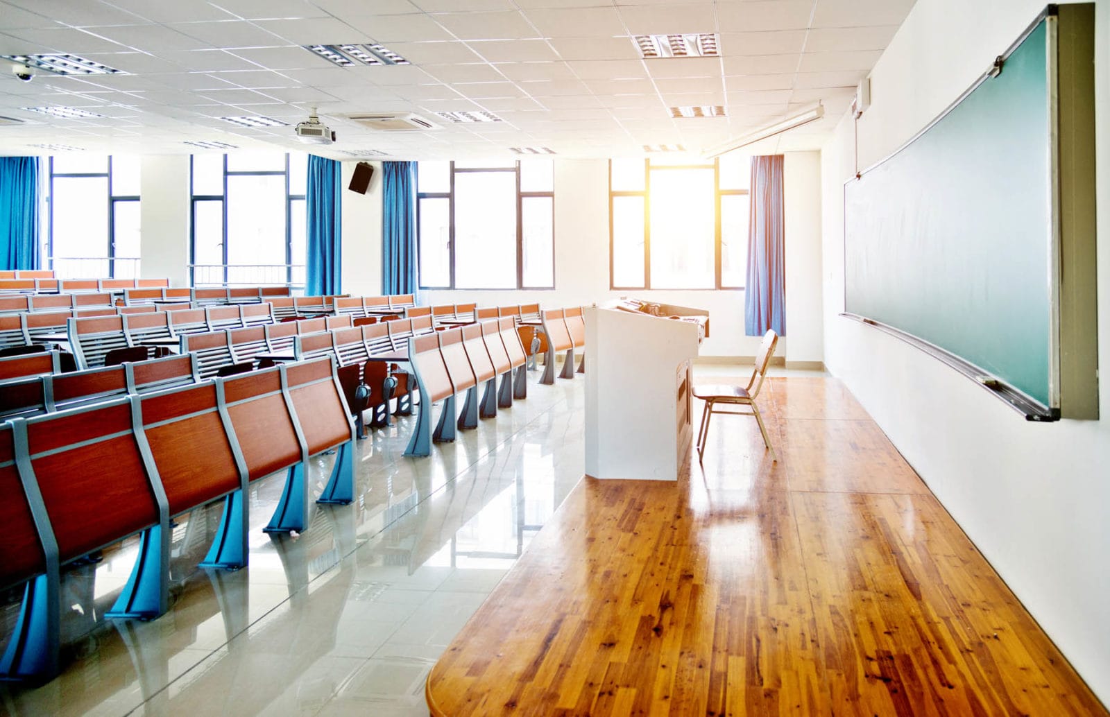 Empty classroom with wooden furniture