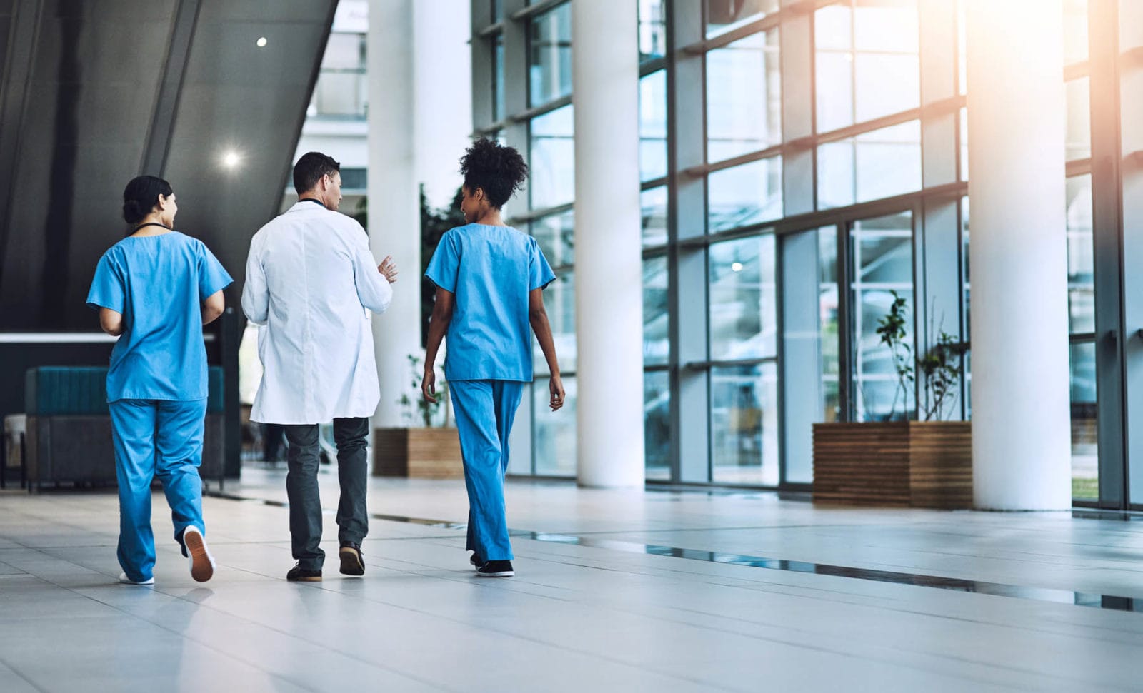 Medical professionals walking in hospital