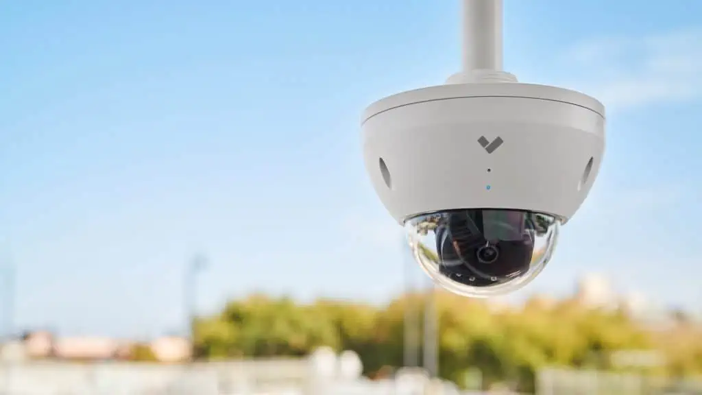 Verkada pricing installation by GotUWired technician mounting a commercial security camera